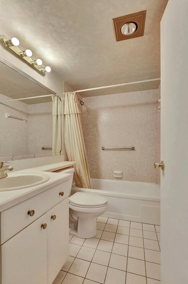 full bathroom with shower / tub combo, vanity, tile patterned floors, and toilet