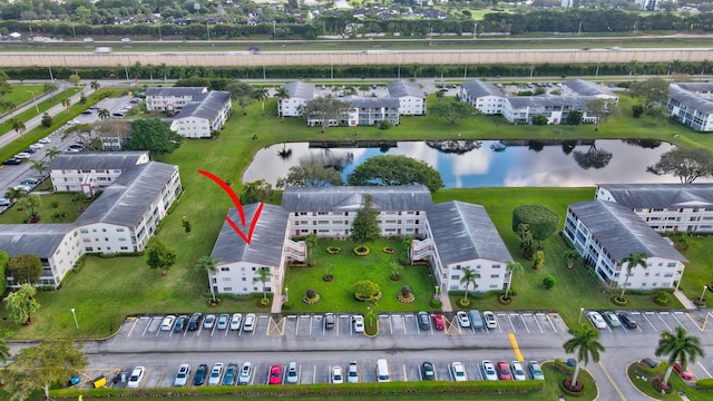 birds eye view of property featuring a water view