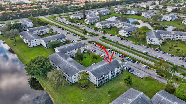 birds eye view of property featuring a water view