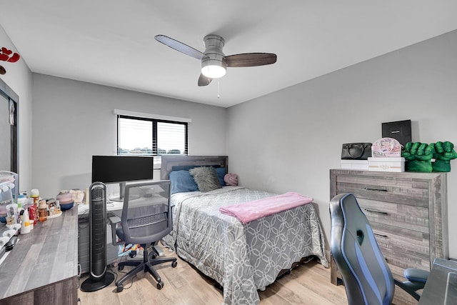 bedroom with ceiling fan and light hardwood / wood-style flooring