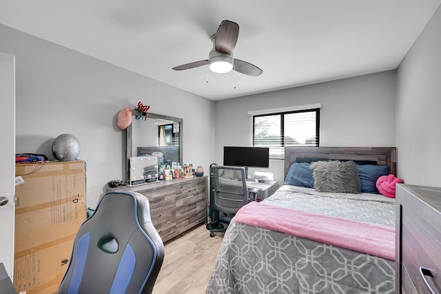 bedroom featuring ceiling fan and light hardwood / wood-style flooring