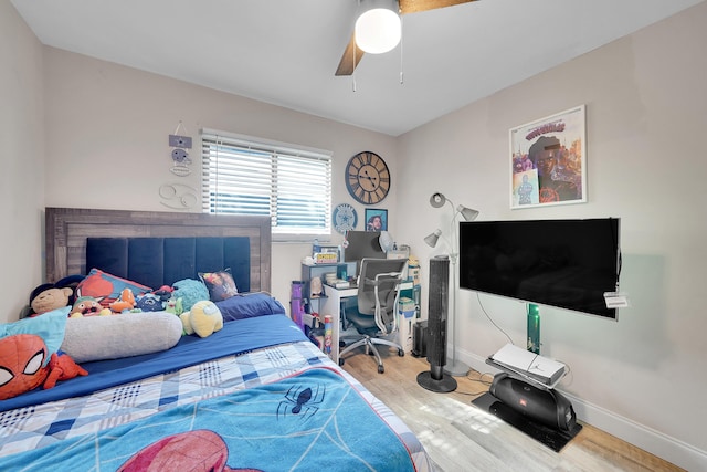 bedroom with wood-type flooring and ceiling fan