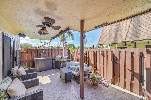 view of patio with outdoor lounge area and ceiling fan