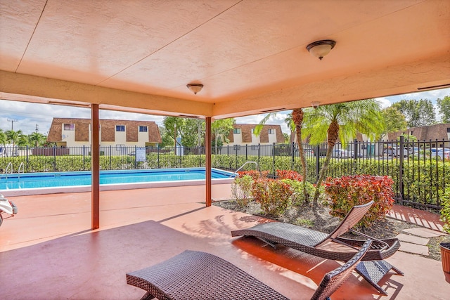 view of patio / terrace featuring a community pool