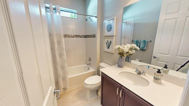 full bathroom with vanity, shower / bath combination with curtain, and toilet