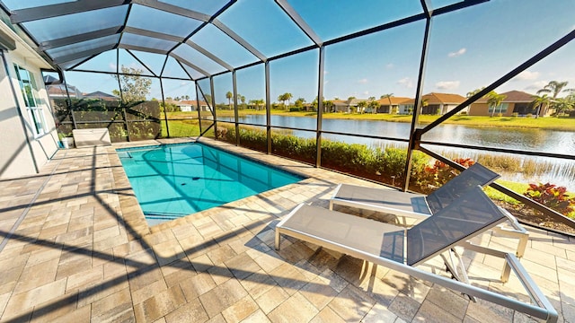 view of pool featuring a lanai, a patio area, and a water view