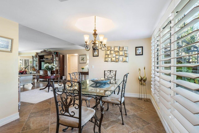 dining room featuring a notable chandelier