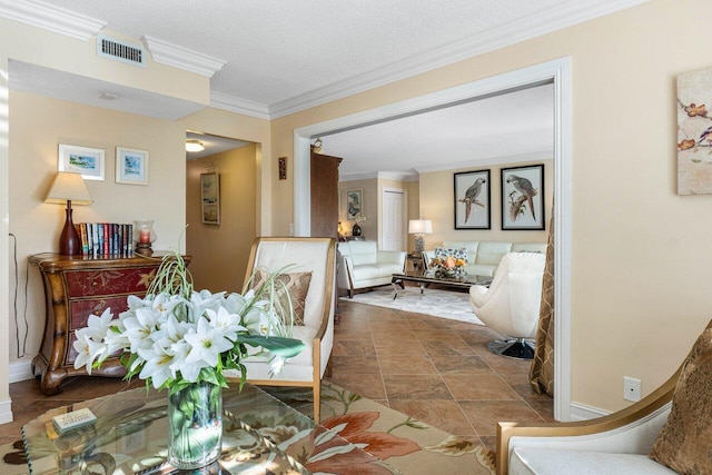 dining area with ornamental molding and a textured ceiling