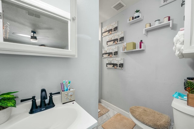 bathroom featuring sink and toilet