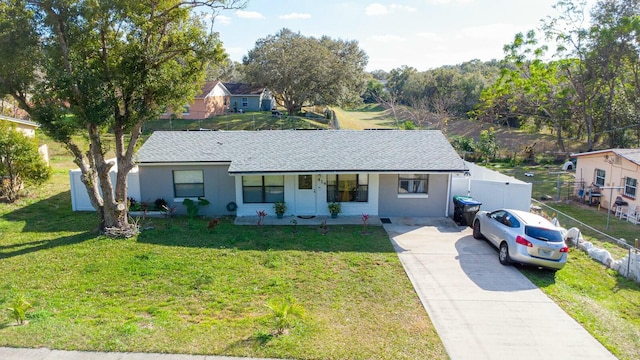 ranch-style home with a porch and a front yard