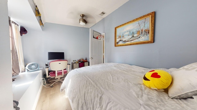 bedroom featuring hardwood / wood-style flooring and ceiling fan