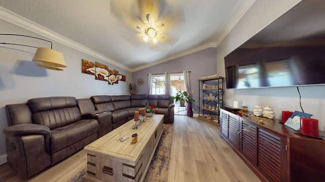 living room with crown molding, vaulted ceiling, ceiling fan, and light wood-type flooring