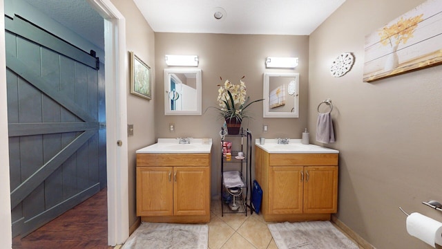 bathroom with vanity and tile patterned floors