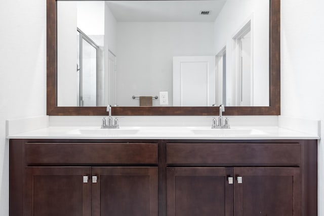 bathroom with vanity and walk in shower
