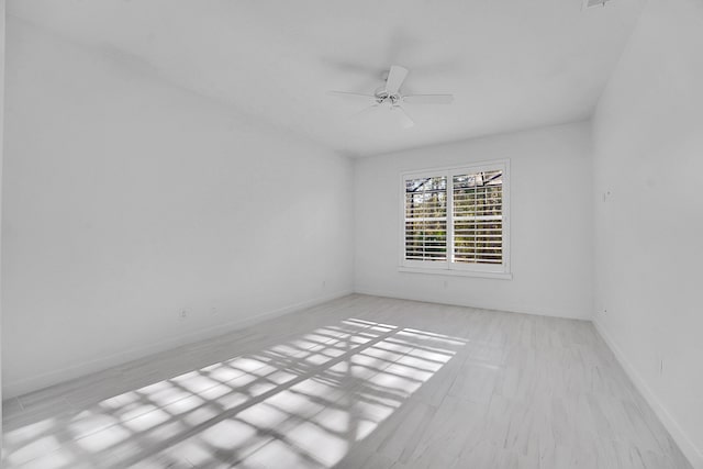 spare room with ceiling fan