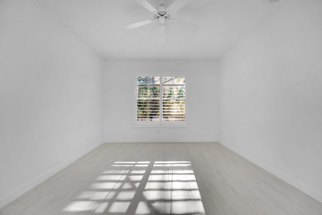 spare room with ceiling fan and light hardwood / wood-style flooring