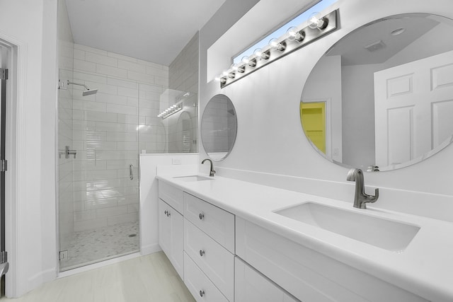 bathroom with vanity and an enclosed shower