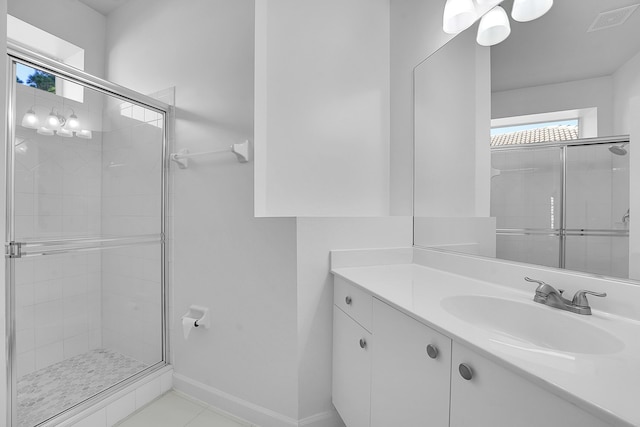 bathroom with vanity and walk in shower