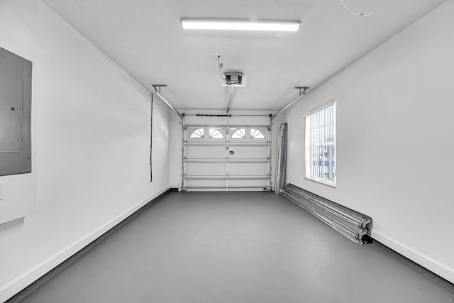 garage featuring a garage door opener and electric panel