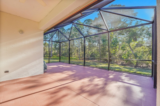 view of patio featuring a lanai