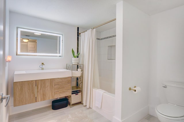 full bathroom featuring toilet, vanity, and shower / bath combo with shower curtain