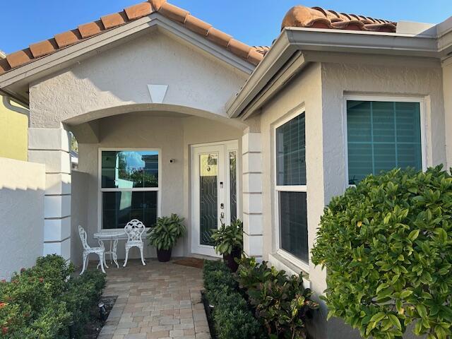 entrance to property with a patio area