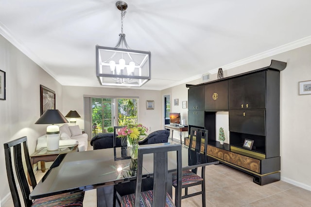 dining room with light tile patterned flooring, crown molding, and a chandelier