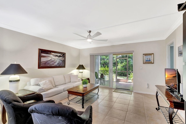 living room featuring light tile patterned floors, crown molding, and ceiling fan