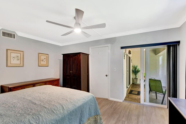 bedroom with ornamental molding, ceiling fan, and light wood-type flooring