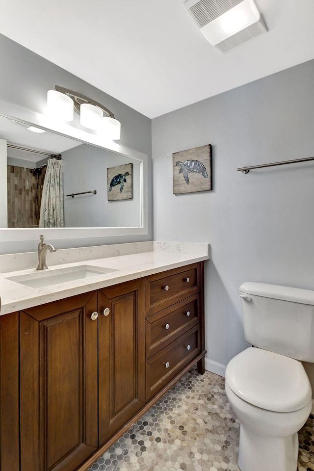 bathroom featuring vanity, toilet, and a shower with shower curtain