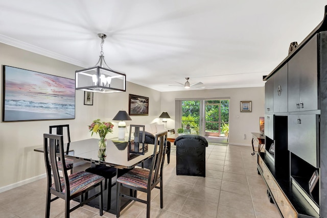 tiled dining room with ornamental molding and ceiling fan with notable chandelier