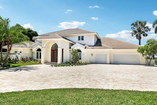 view of front of property with a garage