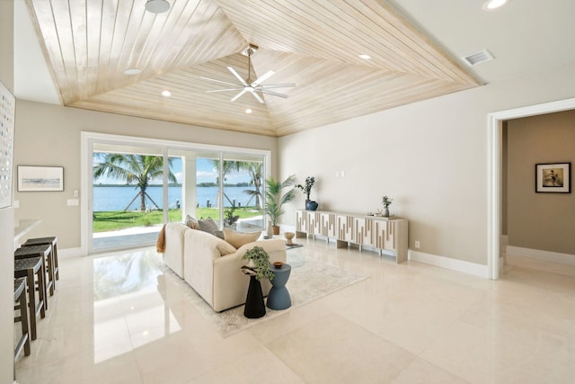 tiled living room with a raised ceiling, ceiling fan, and wood ceiling