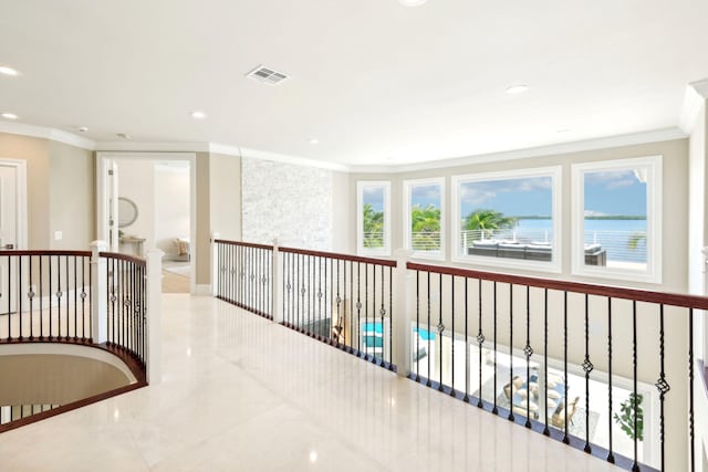 hallway featuring ornamental molding