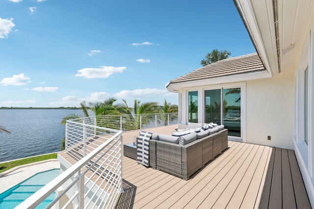 deck with a water view and an outdoor hangout area