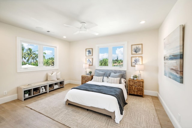 bedroom featuring light hardwood / wood-style floors and ceiling fan