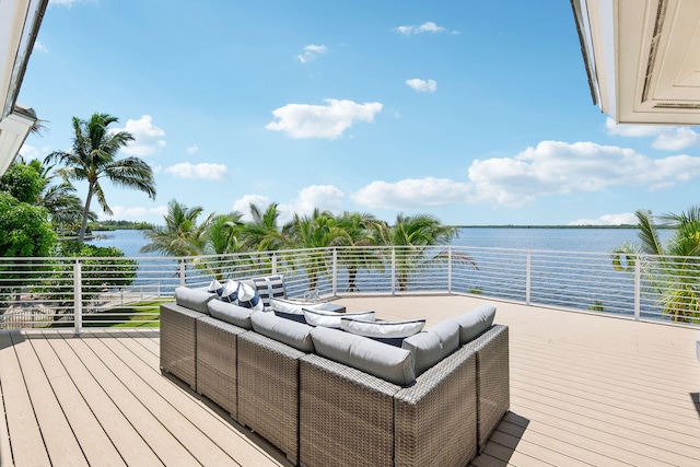 wooden deck featuring a water view and an outdoor hangout area