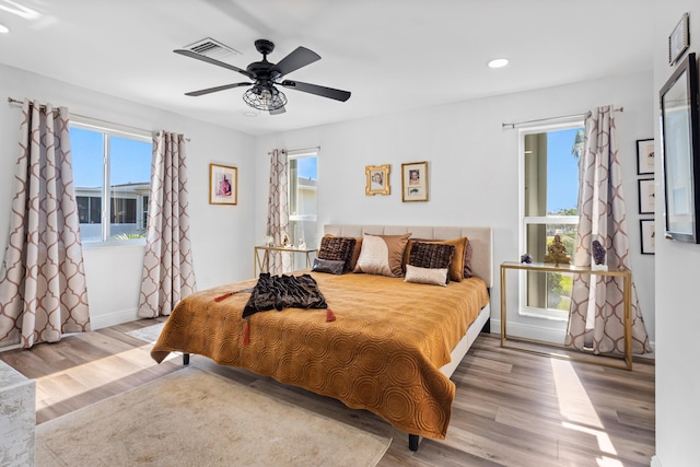 bedroom featuring ceiling fan and light hardwood / wood-style floors