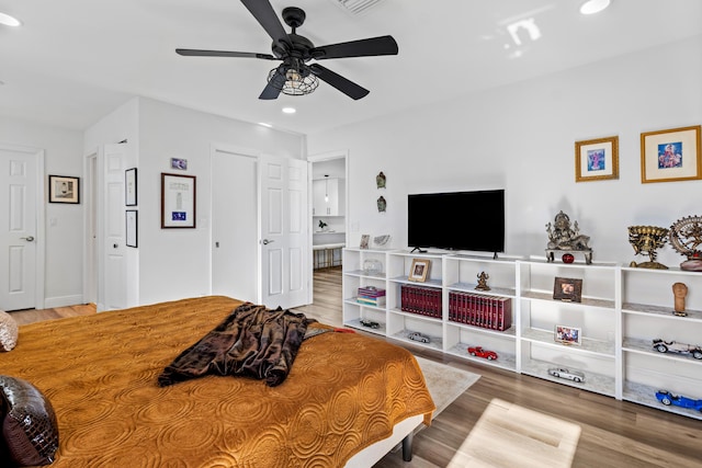 bedroom featuring hardwood / wood-style flooring and ceiling fan