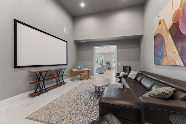 home theater with a towering ceiling