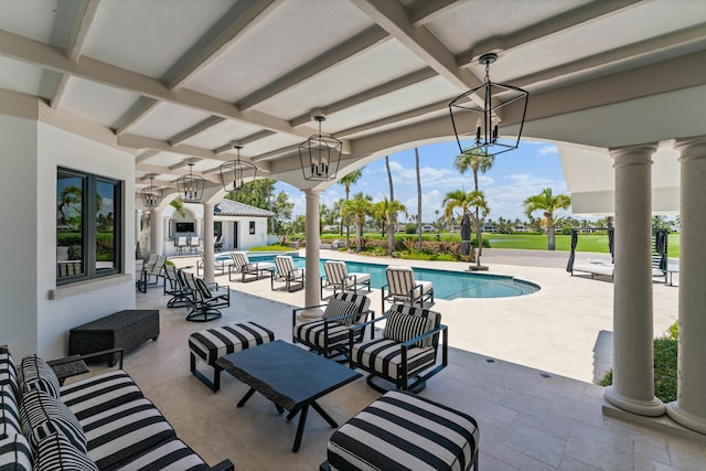 view of swimming pool with a patio