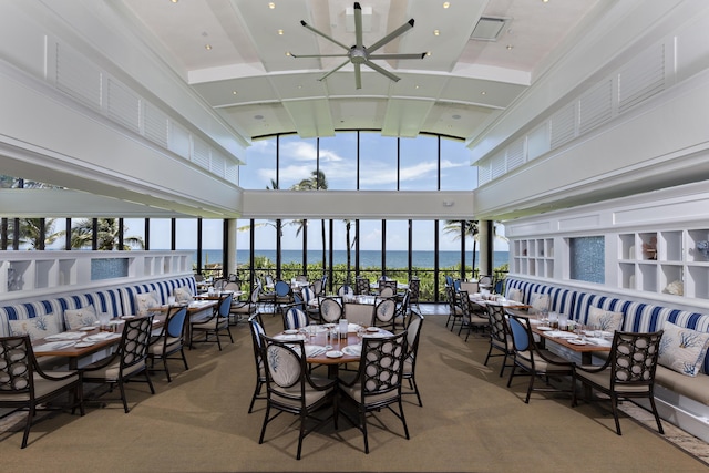 interior space featuring a water view and ceiling fan