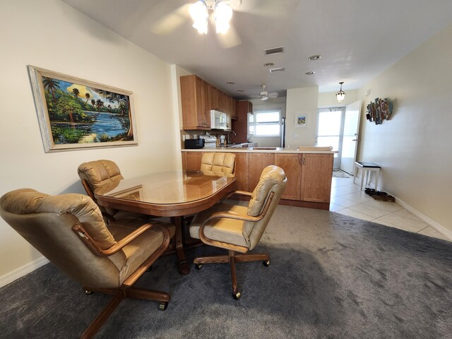 carpeted living room featuring ceiling fan