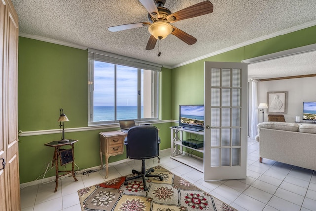 tiled home office with ceiling fan, ornamental molding, and a textured ceiling