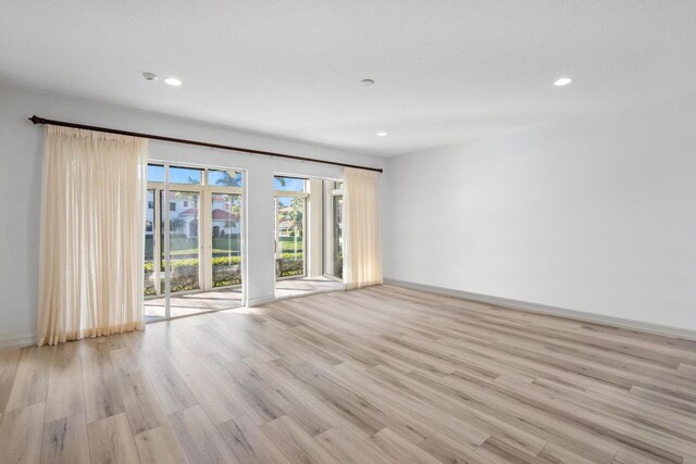 unfurnished sunroom with a water view and ceiling fan