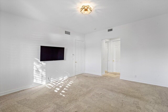 bathroom with tile patterned flooring, plus walk in shower, and vanity