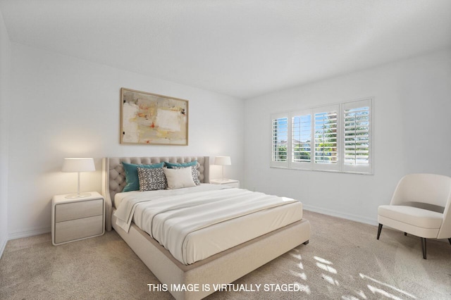 carpeted bedroom featuring baseboards