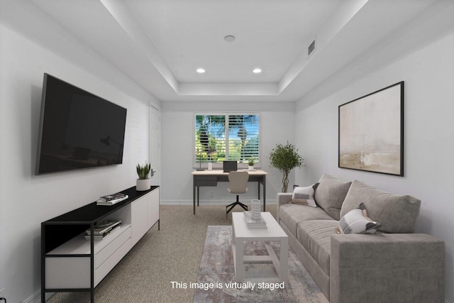 living room with a tray ceiling, recessed lighting, visible vents, and baseboards