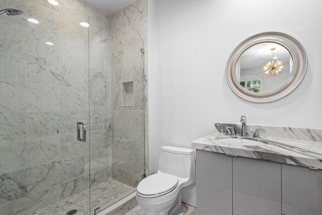 full bath featuring toilet, a shower stall, and vanity