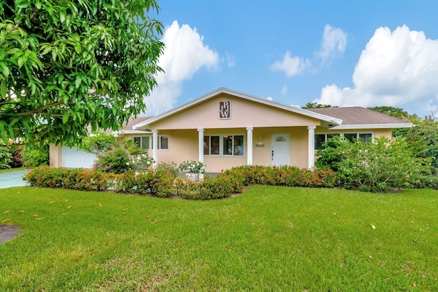 ranch-style home featuring a garage and a front yard